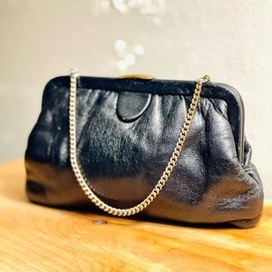 Vintage black leather handbag w/ gold accents.